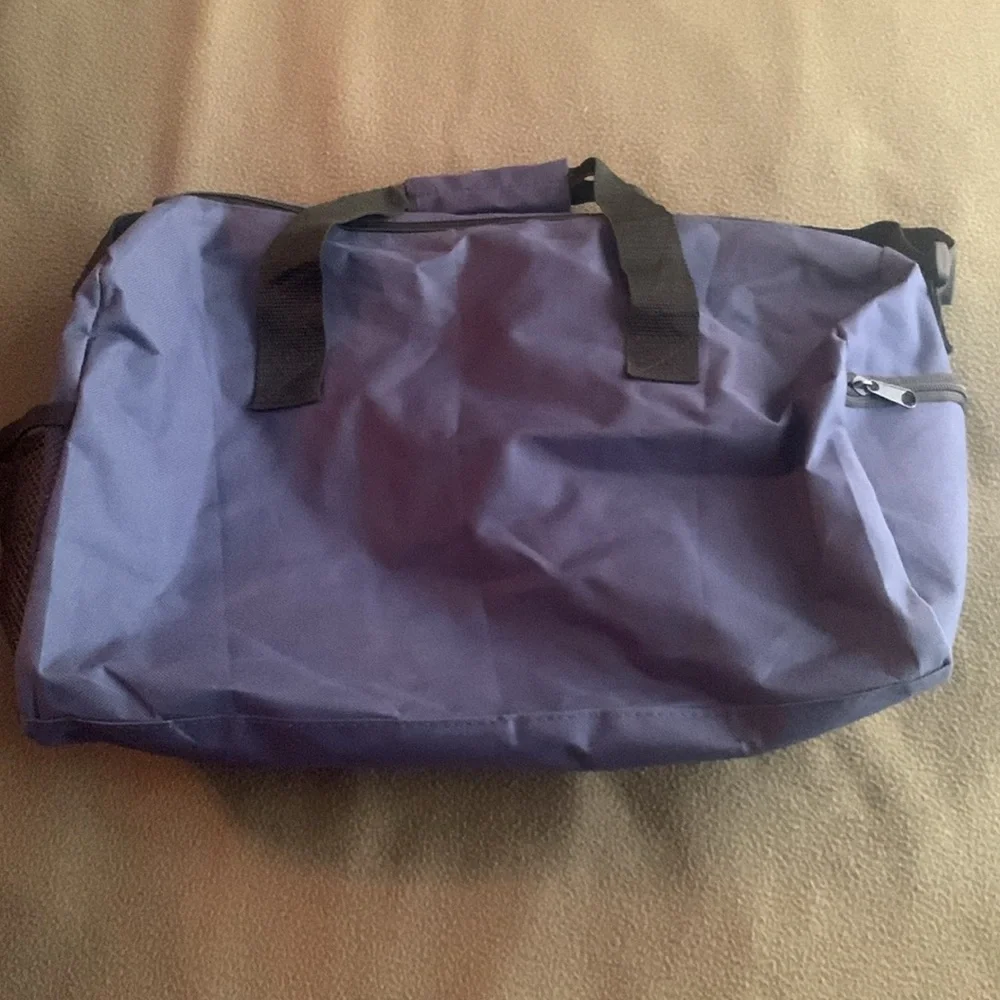 Smithsonian Air & Space blue and black duffel bag. Approx 17” x 9” x 7 1/4”